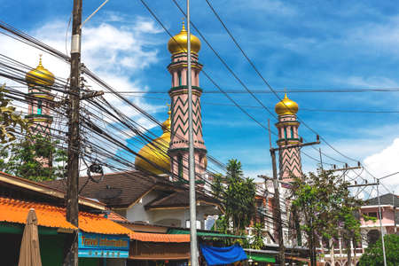 Krabi Town, Thailand - December 16, 2016: Streets of the suburb, cars and buildings.のeditorial素材