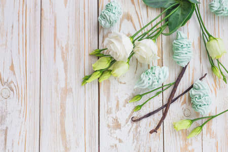 Homemade marshmallow dessert, vanilla sticks and white eustoma flowers. Spring conceptの写真素材