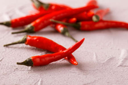 Red Chili peppers on stone table. Vegetables, Close up