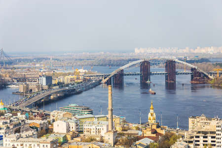 Aerial view of the Kiev city, Kyiv, Ukraine. Dnieper river and bridges. Podil.のeditorial素材
