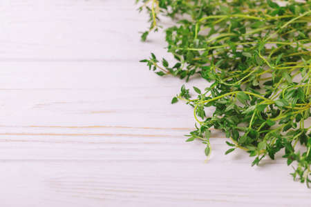 Bunch of fresh organic thyme on a rustic wooden background. Close upの写真素材