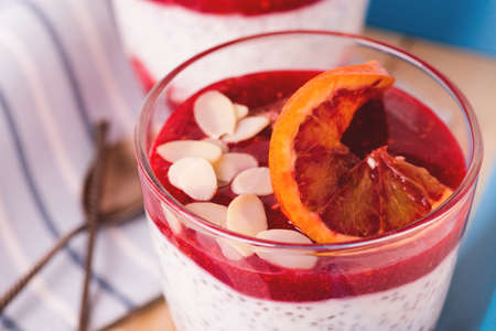 Chia pudding with fresh bloody orange and jam. Superfoods and healthy food concept.Selective focus. Breakfast idea.の写真素材
