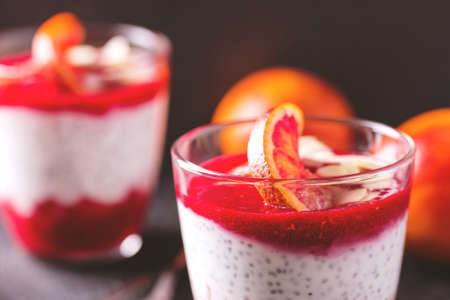 Chia pudding with fresh bloody orange and jam. Superfoods and healthy food concept.Selective focus. Breakfast idea.の写真素材