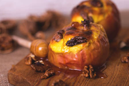 Red Apples  baked with stuffed cottage cheese, walnuts and honey. Healthy food and diet conceptの写真素材