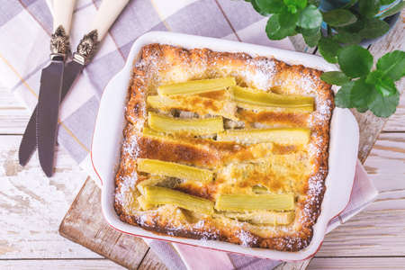 Traditional rhubarb pie. Sweet pieplant cake. Baked pastry food on rustic wooden table backgroundの写真素材
