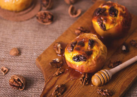 Red Apples  baked with stuffed cottage cheese, walnuts and honey. Healthy food and diet conceptの写真素材