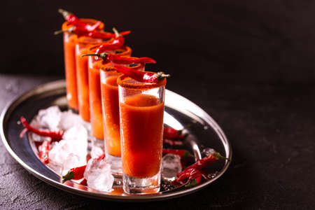 Bloody Mary cocktail with spicy smoked ground chili pepper, ice and celery.の写真素材