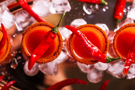 Bloody Mary cocktail with spicy smoked ground chili pepper, ice and celery.の写真素材