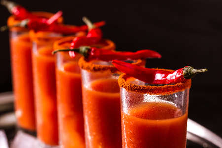 Bloody Mary cocktail with spicy smoked ground chili pepper, ice and celery.の写真素材