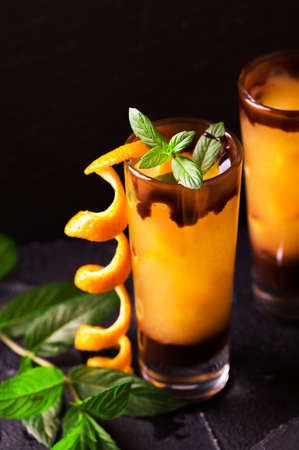 Aperitif with vodka, orange juice, chocolate and mint. Selective focus. Screwdriver short cocktail drink. Summer refreshmentの写真素材