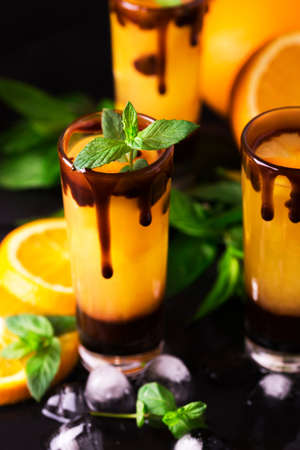 Aperitif with vodka, orange juice, chocolate and mint. Selective focus. Screwdriver short cocktail drink. Summer refreshmentの写真素材