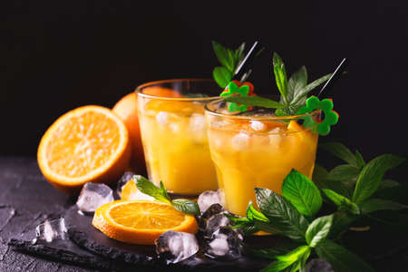 Aperitif with vodka, orange juice and mint. Selective focus. Classic Screwdriver cocktail drink. Summer refreshmentの写真素材