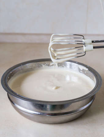 Eggs and sugar in mixing bowlの写真素材