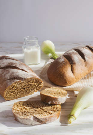 Whole wheat homemade bread, bio ingredients, healthy food. Milk, meal and eggsの写真素材