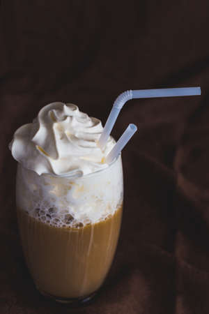 Glass of coffee latte with whipped sour cream