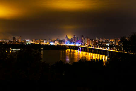 Kyiv city and Dnipro river, bridge, after sunset night viewの写真素材