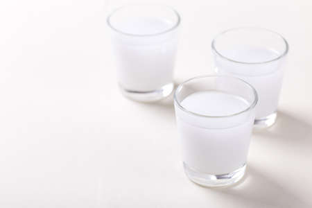 Arabic alcohol drink Raki with anis on white background.Turkish and Greek Traditional aperitif arak,...