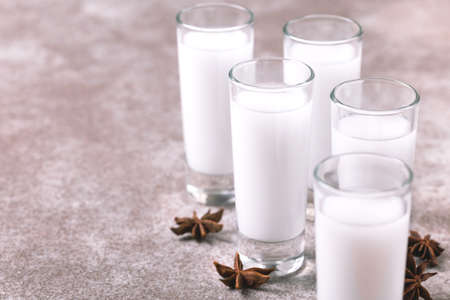 Arabic alcohol drink Raki with anis on slate gray background.の写真素材