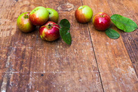 Red ripe apples at dark wooden table. Harvest concept. Copyspaceの写真素材