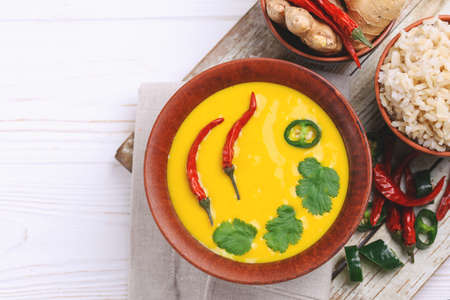 Traditional Indian cuisine. Vegetarian curry Gujarati Kadhi with chickpea gravy and sour yogurt. Copyspace, top view, flatlayの写真素材