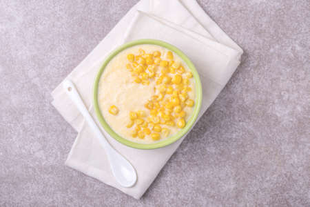 Polenta with feta. Corn porridge. Italian appetizers. Wooden background. Top view.の写真素材