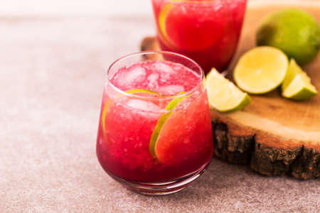 Alcoholic cocktail sour cherry gin or porch crawler with liqueur and lime. Or lemonade. Black background. Horizontal view. Copy spaceの写真素材