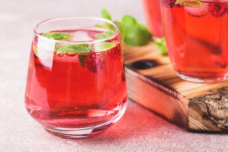 Aperitif  , mint and raspberry, selective focus. Iced lemonadeの写真素材