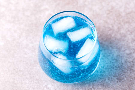 Ice Blue cocktail with thyme. Blue curacao liqueur. Summer drinkの写真素材