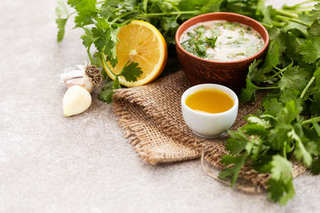 Asian sweet and sour sauce with ingredients on the burlap napkin background. Horizontal view. Copyspaceの写真素材