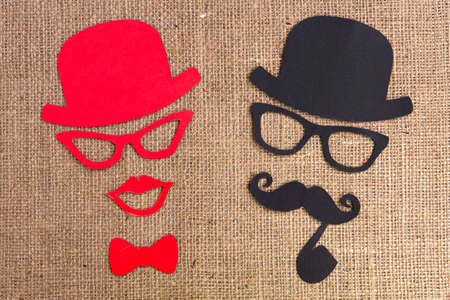 Male and female silhouette patterns with blue ribbon symbol on the burlap background. November...