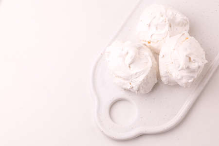 Homemade dessert. French meringues with nuts, pistachios and cup of coffeeの写真素材