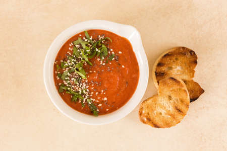 Italian pureed tomato soup gazpacho with croutons and fresh basil. Healthy food concept.の写真素材