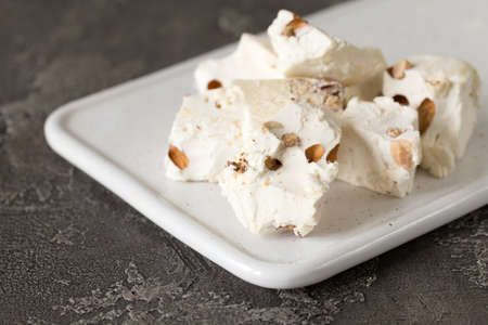 Italian festive torrone. Nougat with almonds. Breakfast conseptの写真素材