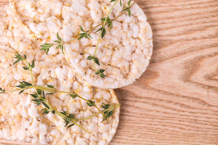 Rice cakes with thyme on white backgroundの写真素材