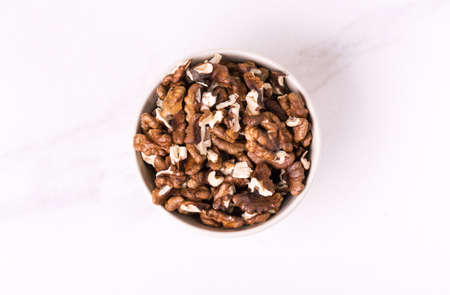 Walnut in bowl. unshelled nuts. vegetarian protein nutritious food.の写真素材