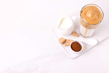 whipped dalgona coffee with milk and cane sugar. trendy South Korean cold summer drinkの写真素材