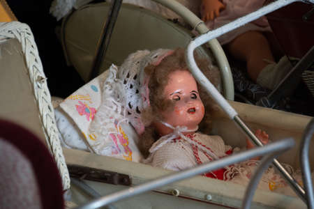 Doll in a pram, old toysの写真素材