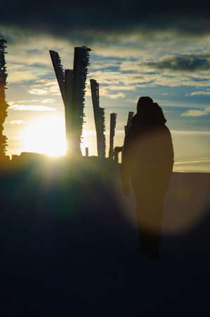 Tourists in the mountains on a winter sunset, Karkonosze, Krkonose, Czech Republicの写真素材