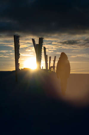 Tourists in the mountains on a winter sunset, Karkonosze, Krkonose, Czech Republicの写真素材