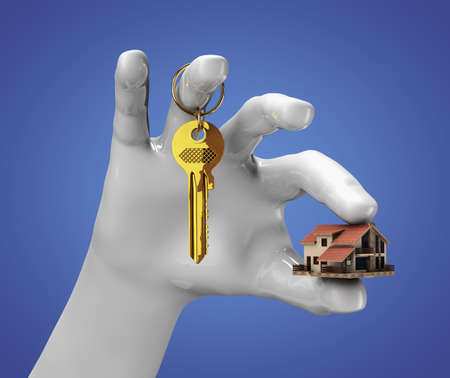 Hand holding small house and some keysの写真素材