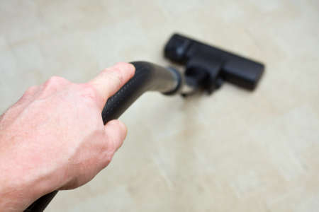 Vacuum cleaner to tidy up the living room の写真素材