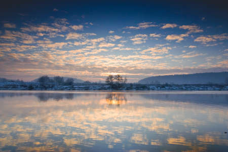 Winter sunrise over the river の写真素材
