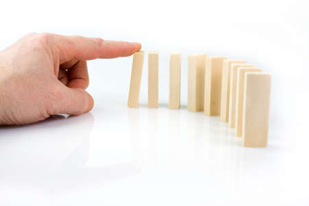 Hand and falling pieces on white background の写真素材