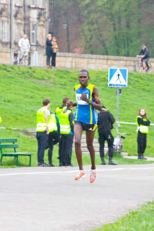 KRAKOW, POLAND - APRIL 28 : Cracovia Marathon. Runner on the city streets on April 28, 2013 in Krakow, POLAND のeditorial素材