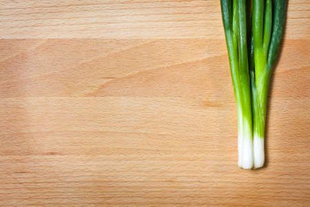 Young onion on cutting board backgroundの写真素材