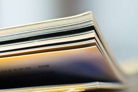 Close-up of magazine pages. Shallow DOF, focus on edges. の写真素材