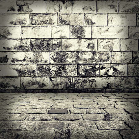 grunge background, red brick wall texture bright plaster wall and blocks road sidewalk abandoned exterior urban background for your concept or project の写真素材