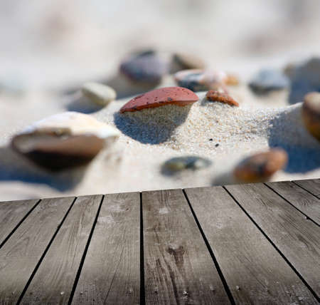 sunset on the beach and empty wooden deck table.の写真素材