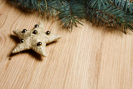 Christmas fir tree with decoration on a wooden board の写真素材