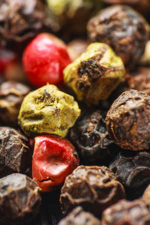 pepper corns on a wooden board の写真素材